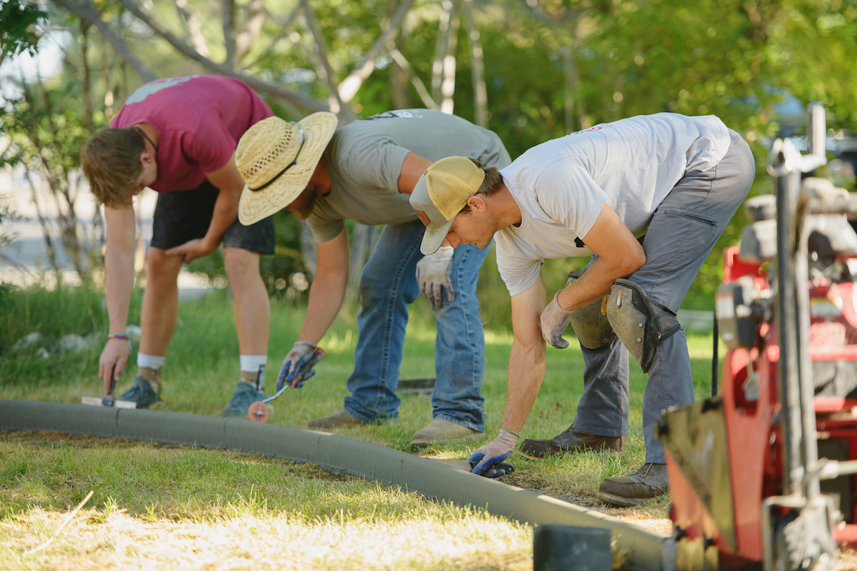 Workers building a new border
