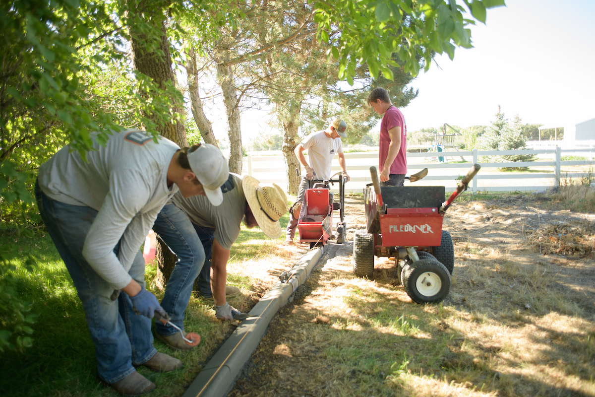 Workers paving a new boarder